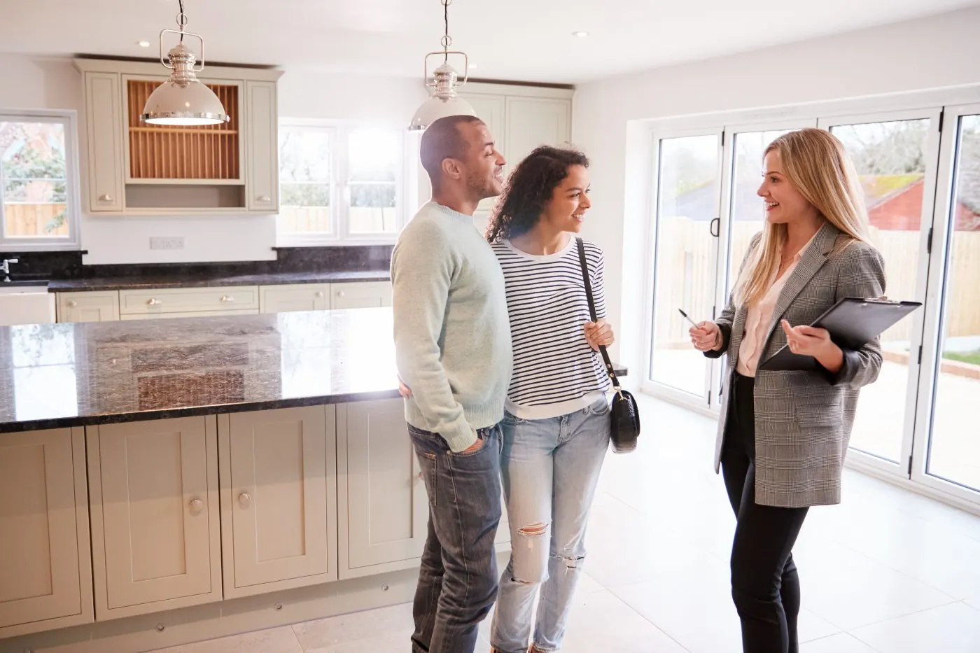 Buyers touring a kitchen with their agent